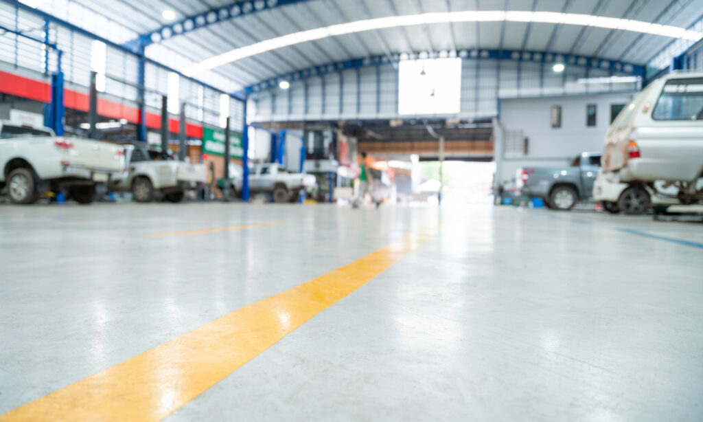 Blurred background of Car repair station paved with anti-slip coating